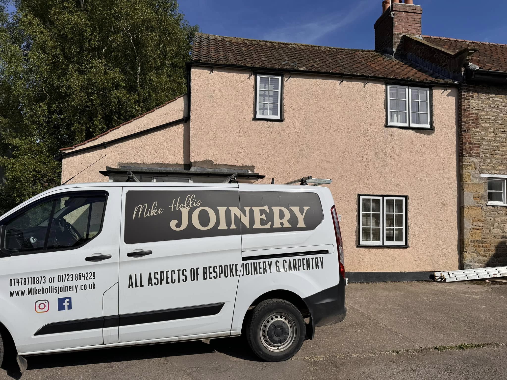 Van outside job site of newly installed windows